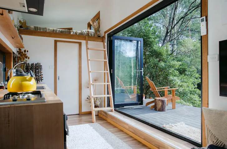 A ladder leads up to the bed at the Mountain Tiny House in Victoria