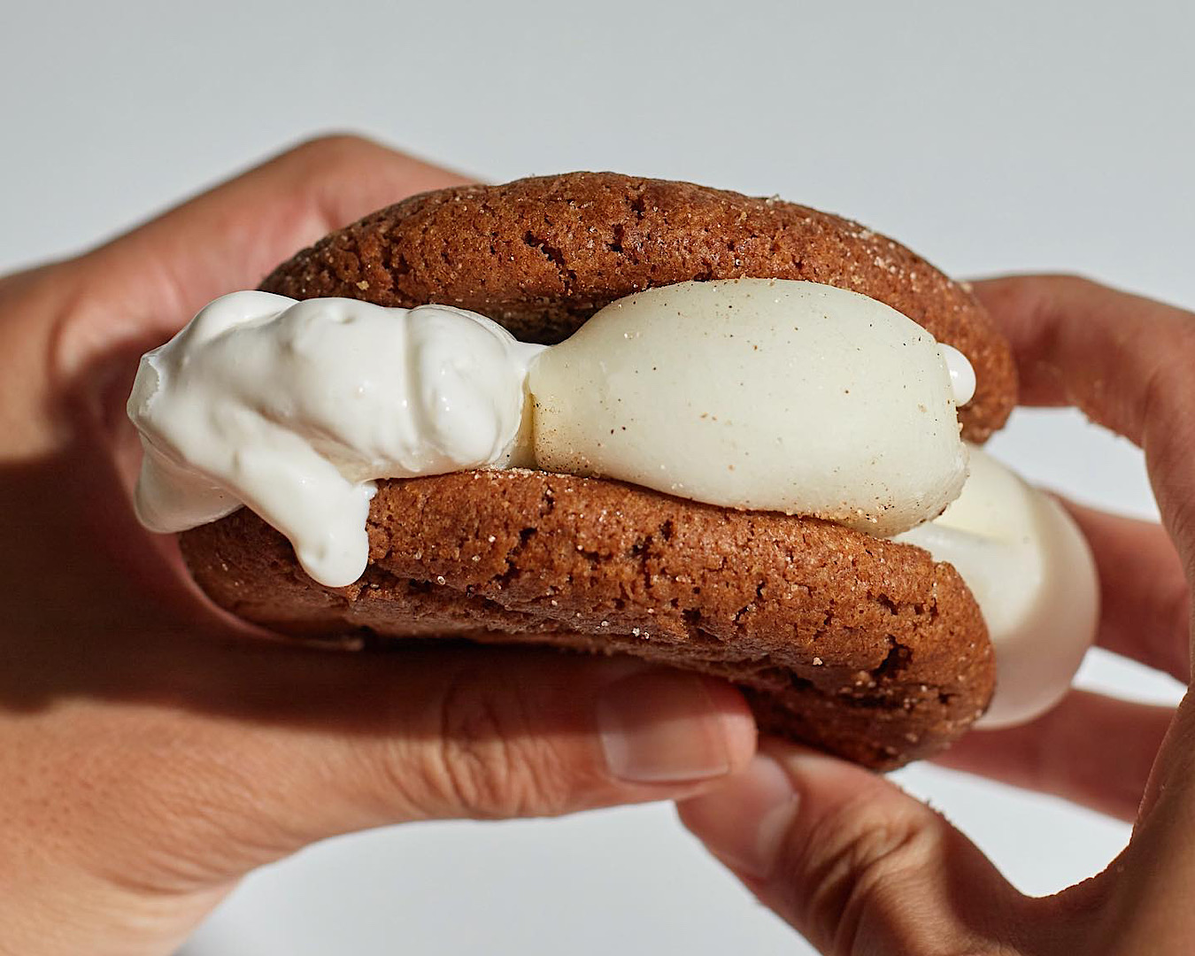 Mochi threaten to squish out of a decadent cookie sandwich by Moustache, one of the best spots in Auckland for late-night dessert. 