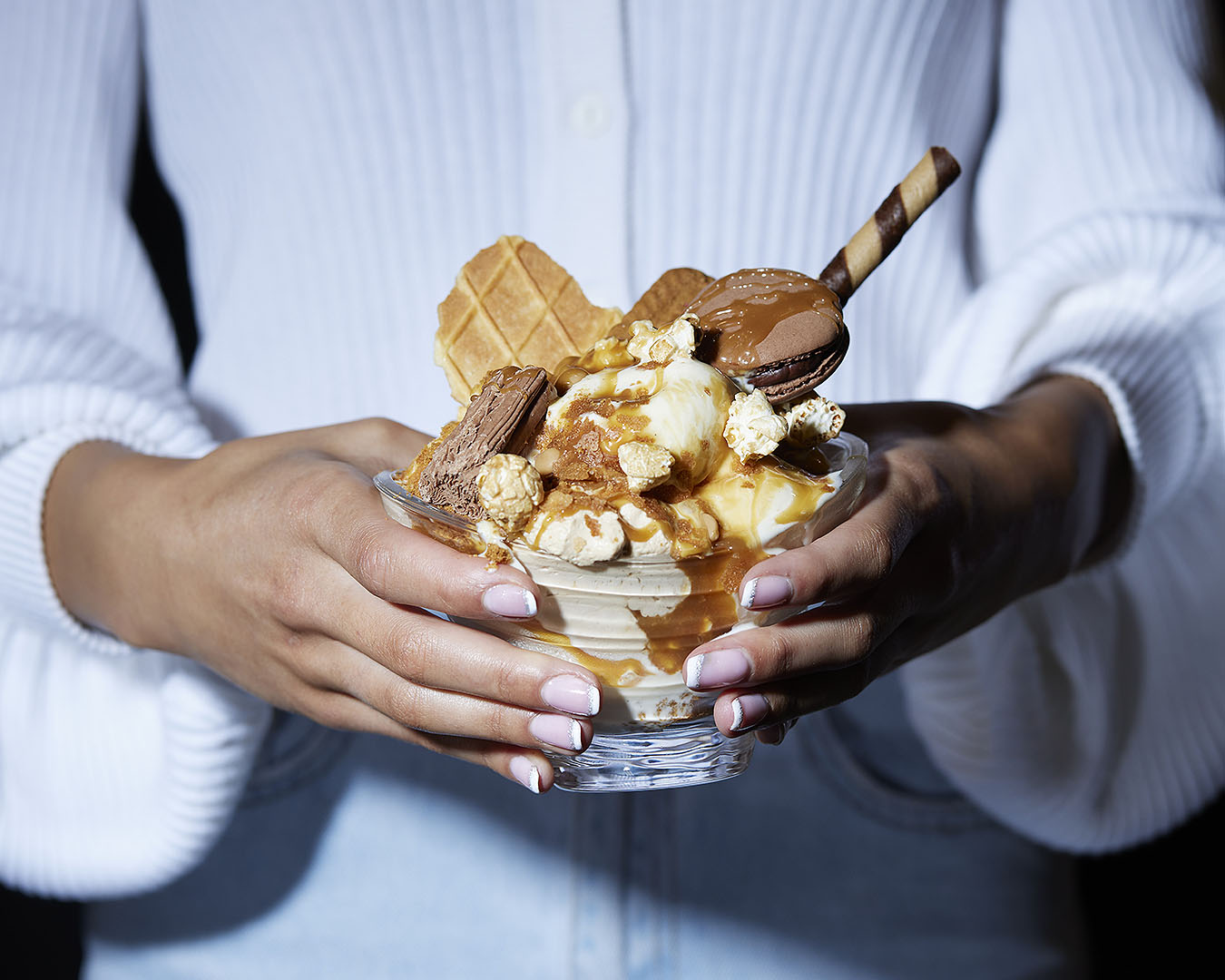 Someone holds an impressive ice cream sundae at the Mövenpick hotel in Wellington.