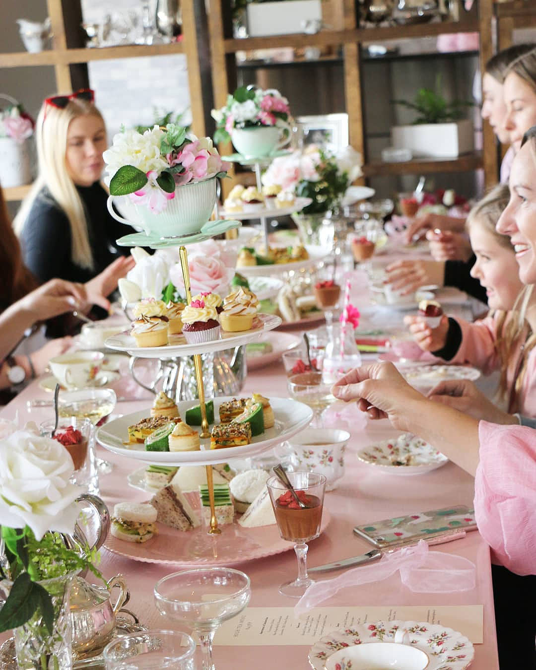 People enjoy a vintage high tea at Moxie, one of the best spots in Auckland for high tea.