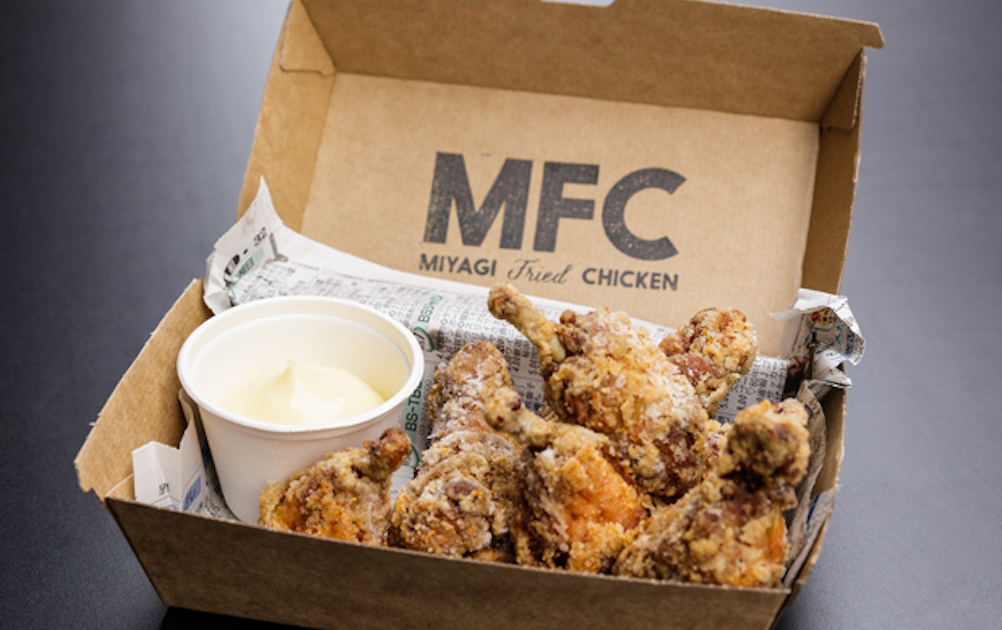 A cardboard takeaway box filled with pieces of some of the best fried chicken melbourne. 