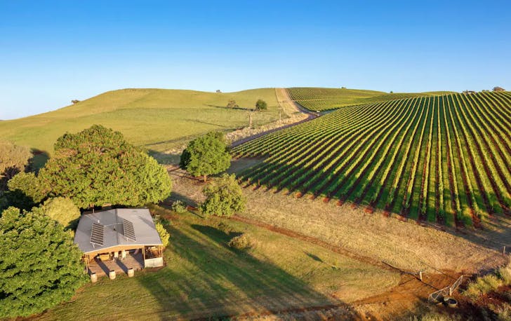 An overhead shot of a best farm stay Victoria with a vineyard. 