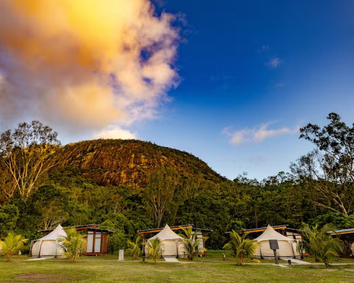 A view of the tents with a mountain in the background at Mt Jukes Eco Retreat glamping Queensland
