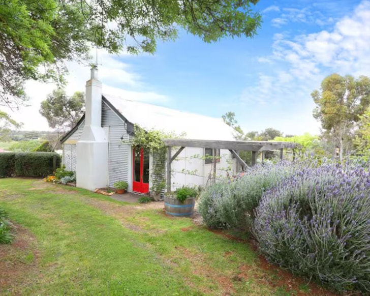 An external view of Mulberry House surrounded by gardens, one of the best accommodation options in Clare Valley