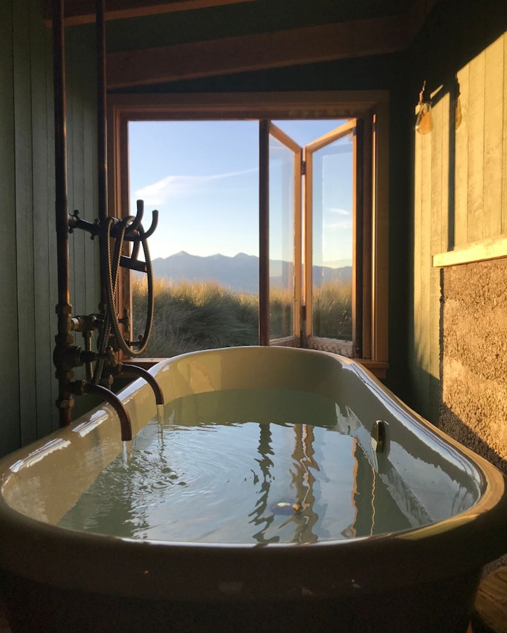 The indoor outdoor bath at The Musterer & Me best tiny homes New Zealand