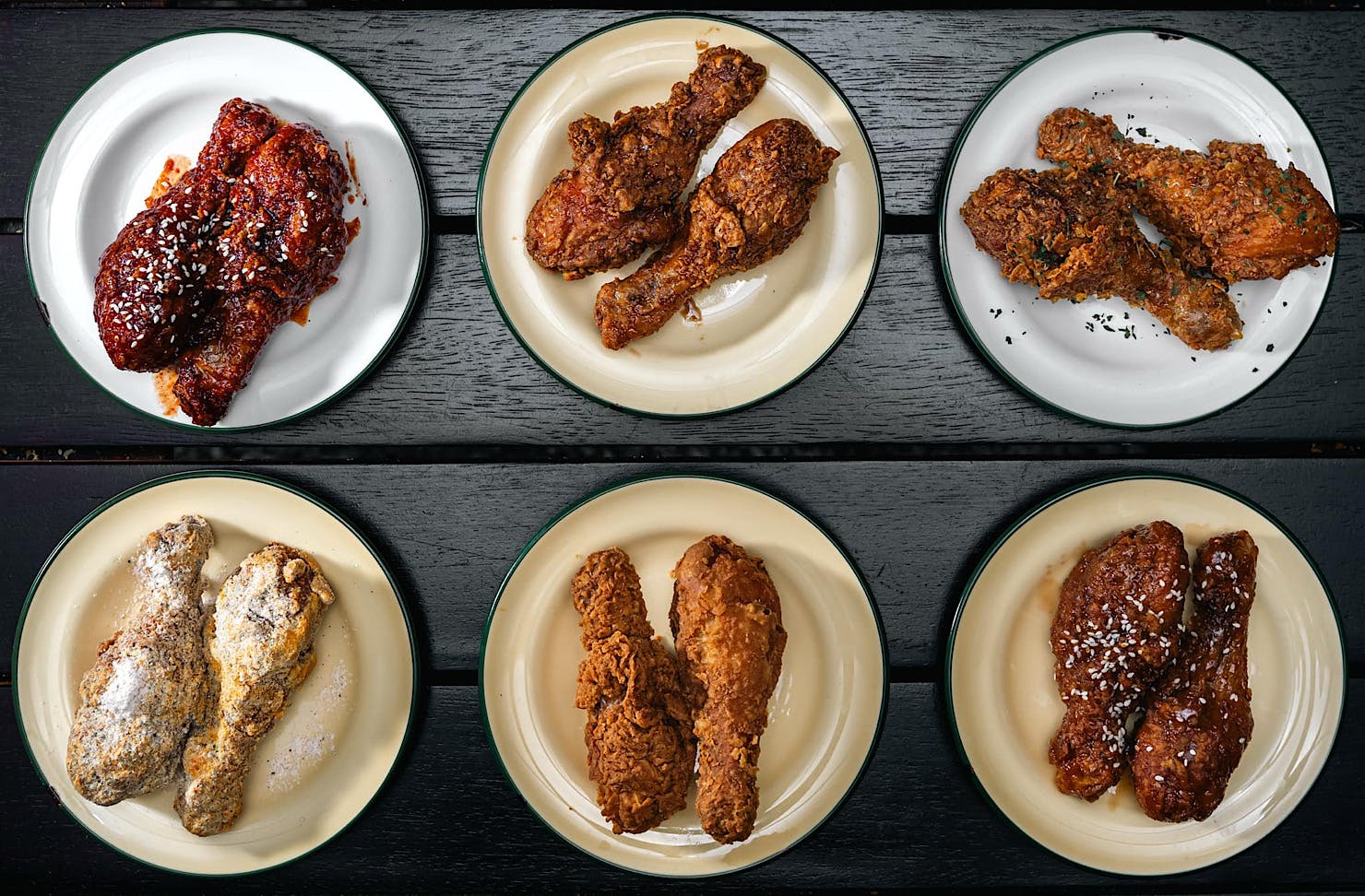 Six plates of different flavoured drumsticks.