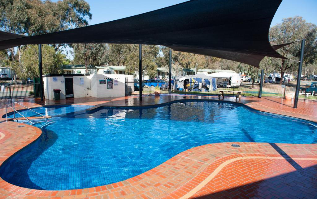 A large kidney pool at an Echuca Caravan park. 