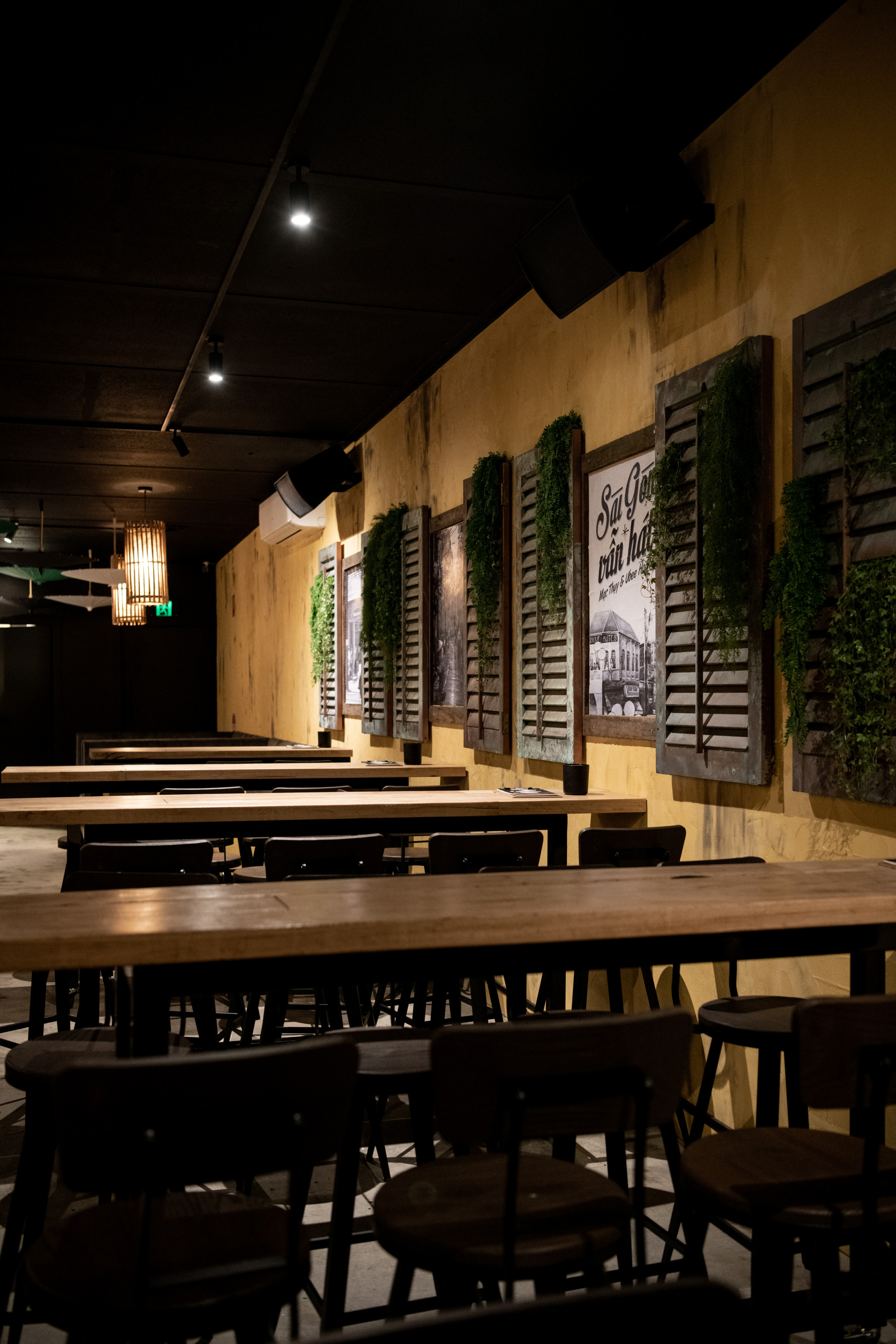 the interior of a speakeasy with yellow walls