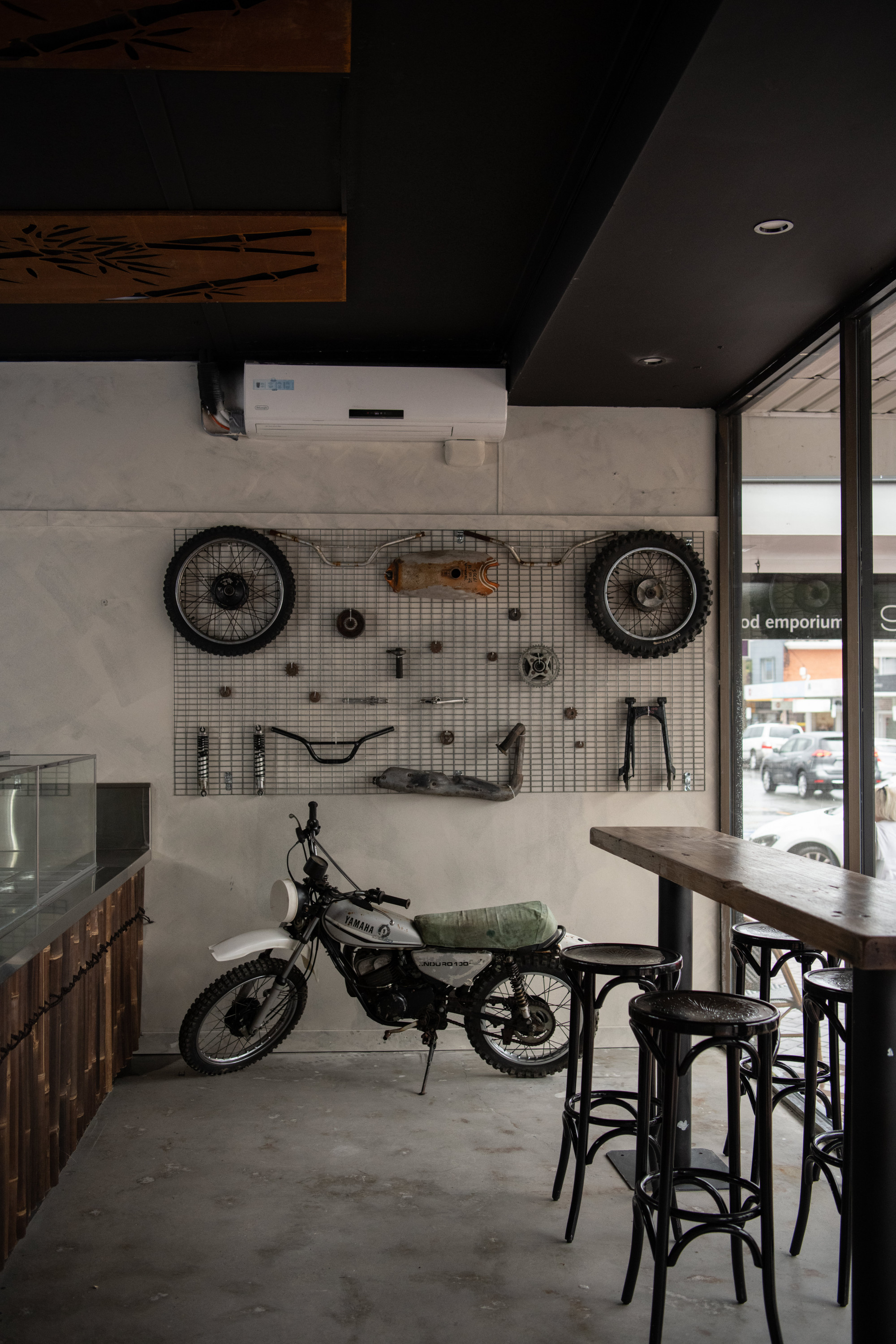 the interior of a banh mi shop with a motorcycle in it