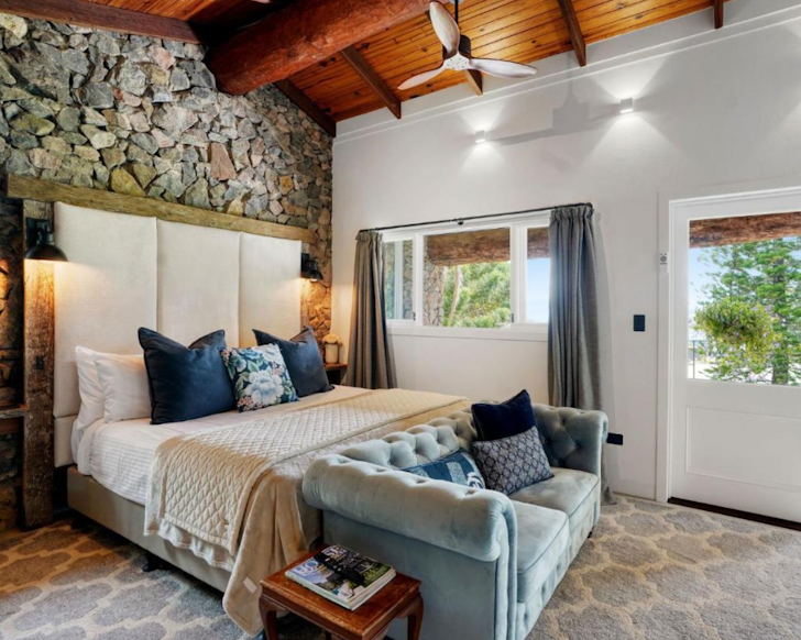 A romantic bedroom at Maleny Country Estate cabin near Brisbane with fireplace 