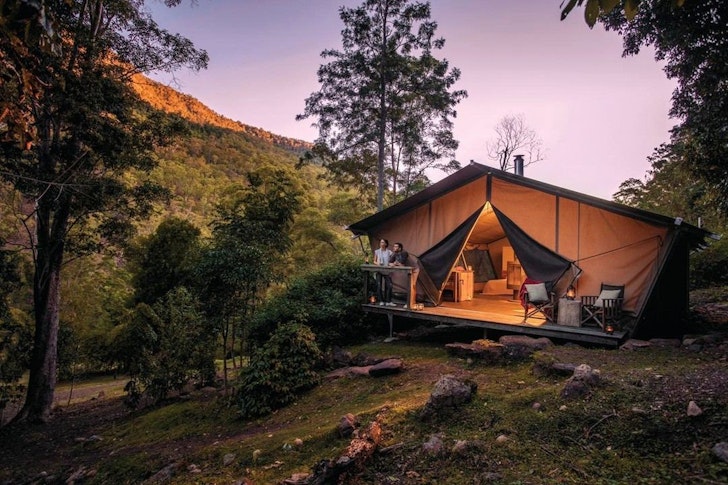 A view of a tent surrounded by nature at Nightfall one of the best glamping spots in Queensland