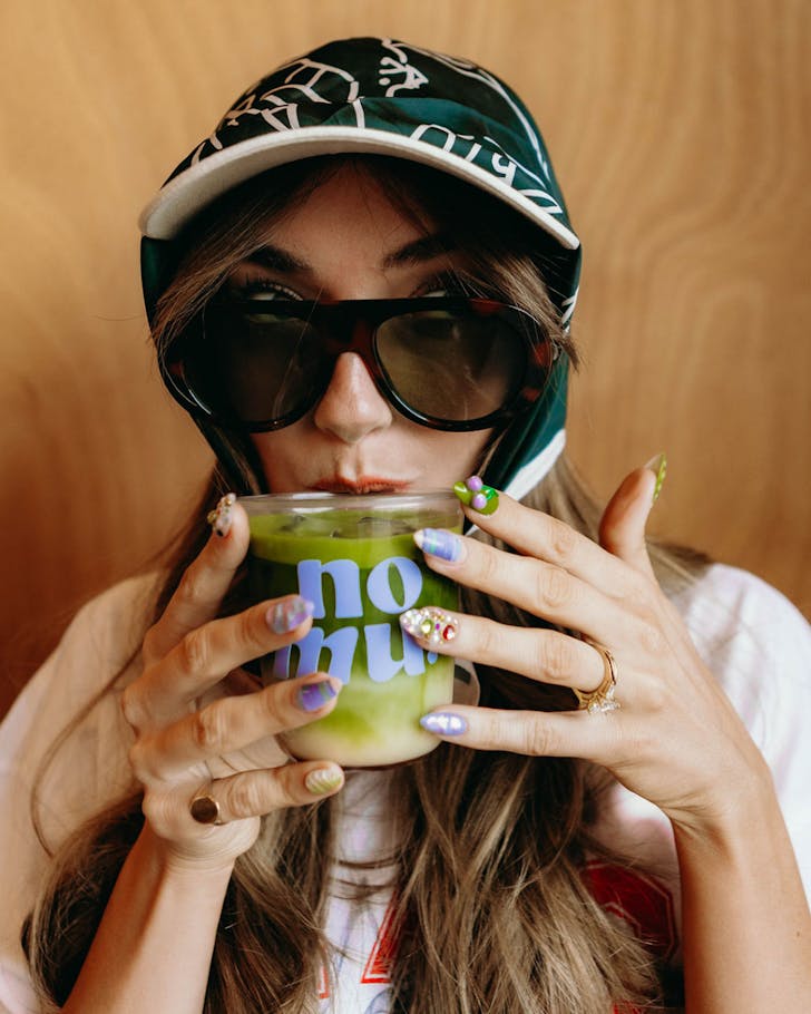 A matcha fan sips on a cup of Nomu's new Premium Grade Matcha. 
