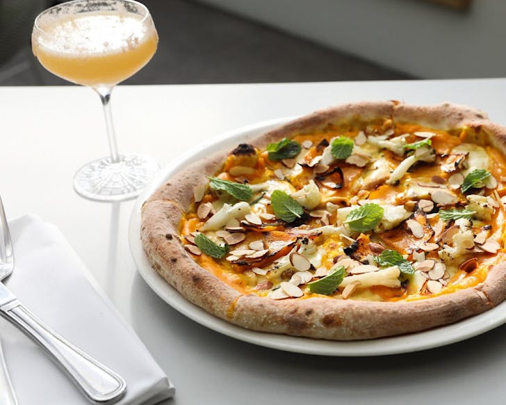 A good-looking pizza and a sugar-rimmed margarita cocktail. 