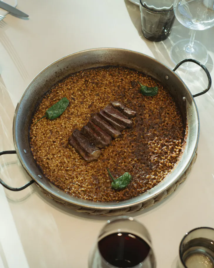 A creative paella dish at Nuara in Barcelona of steak and rice.