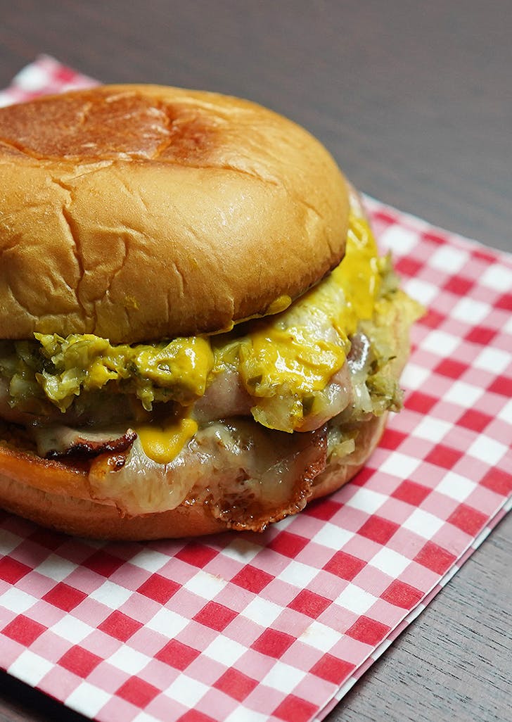 Rocco's Originario sandwich stacked with fried bologna, green olive and mozzarella 