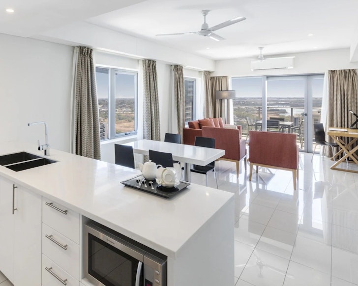 A room with a kitchenette and sea view at Oaks Darwin Elan Hotel one of the best Darwin hotels