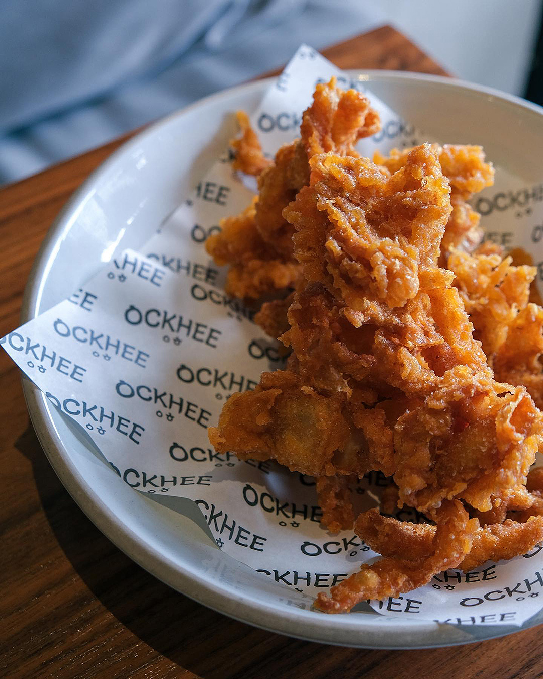A plate of fried chicken skin from Ockhee.
