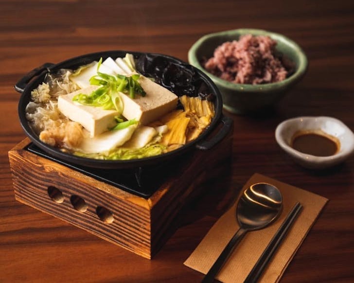 Jeon gol hot pot laden with tofu, kumara noodles and enoki mushrooms