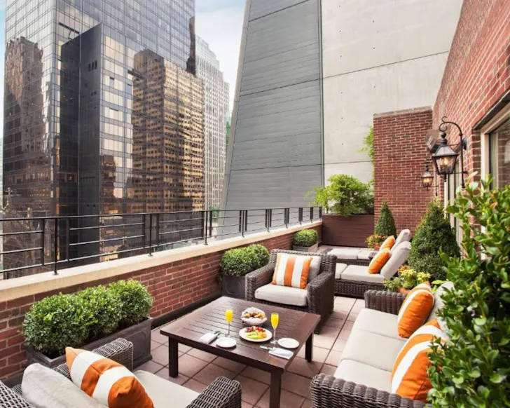 A suite at Omni Berkshire Place best hotels for families New York
