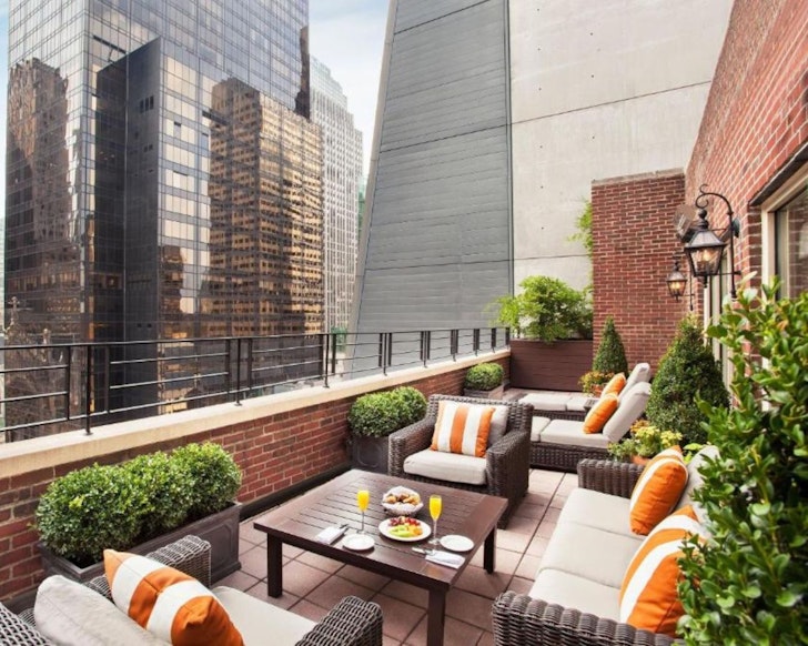 A suite at Omni Berkshire Place best hotels for families New York