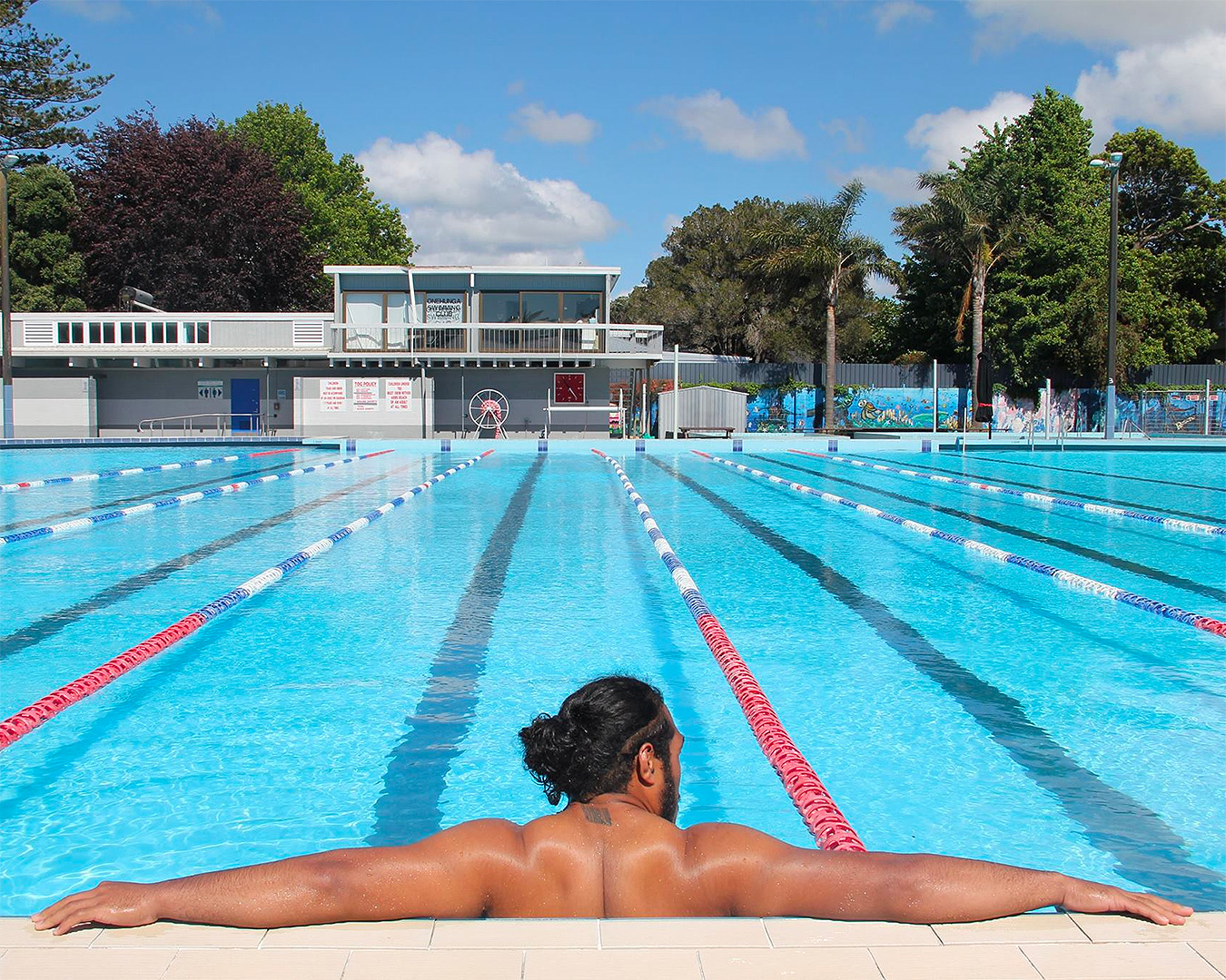 Someone relaxes at the Y Onehunga War Memorial Pool in Auckland.
