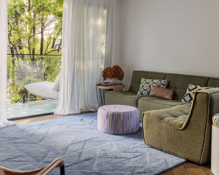 The living space and balcony at v best family friendly Airbnbs near Brisbane