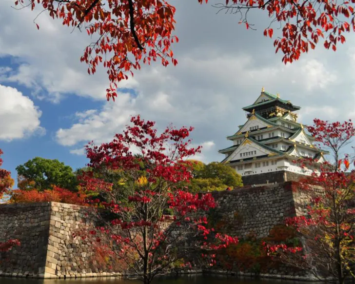 Autumn leaves surround Osaka Castle, steps from Hotel New Otani Osaka.