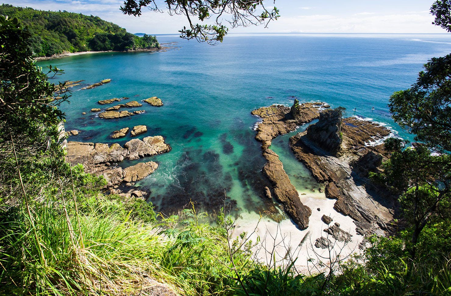 Beautiful blue sea at Otarawairere Bay.