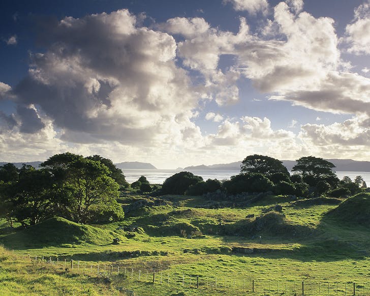 A beautiful green expanse with the sea in the background.