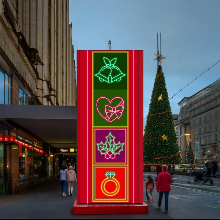 A giant red pillar glowing with Christmas symbols.