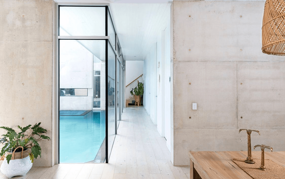 A large concrete hallway with a pool at the best outdoor spa airbnb victoria