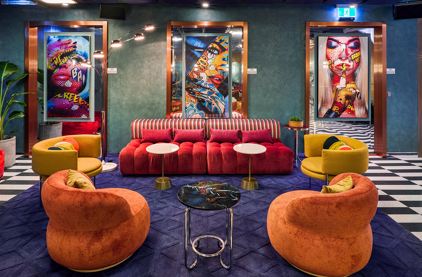 A colourful lobby with artwork and couches at one of the best pet-friendly hotels in Melbourne