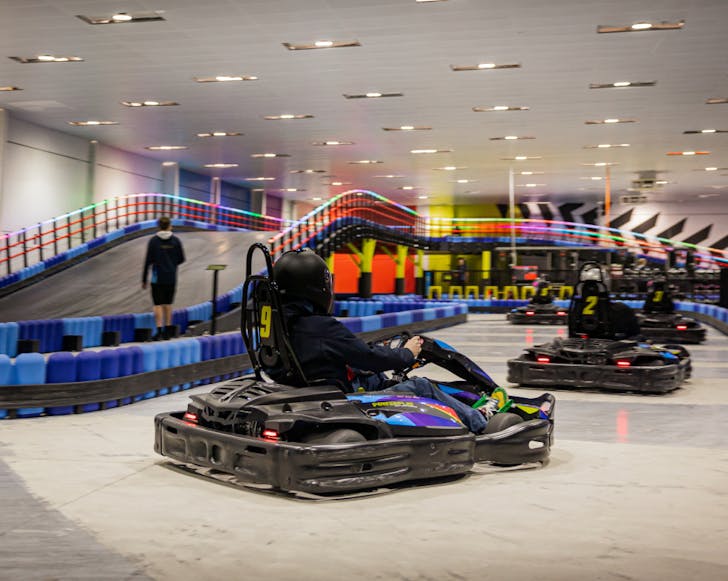 a go-kart rider turns the corner on the power play track