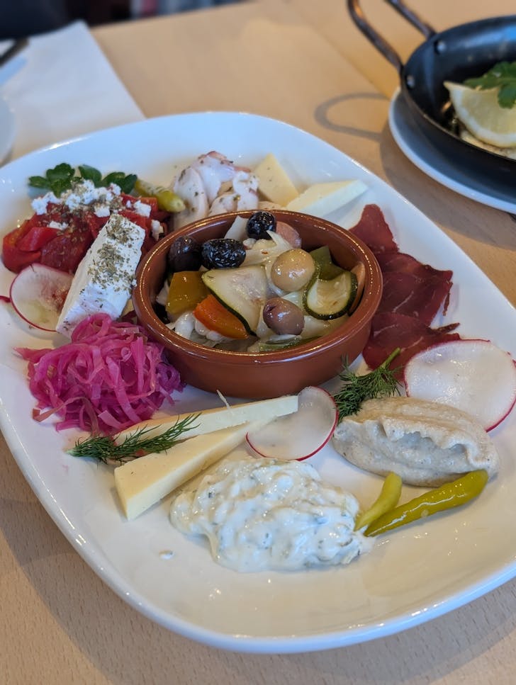 cheese and dips presented on plate at Alpha Ouzeri