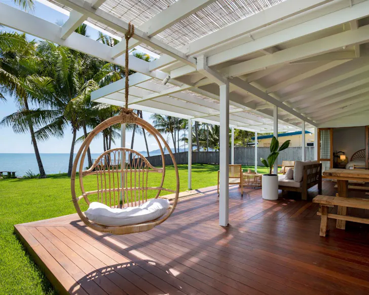 The egg chair with a beach view at Palm Trees Forever best Cairns Airbnbs
