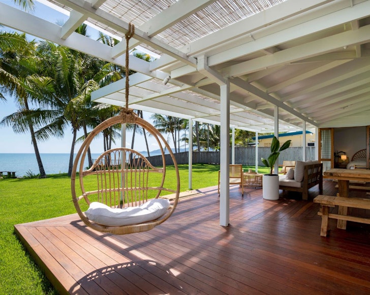 The egg chair with a beach view at Palm Trees Forever best Cairns Airbnbs