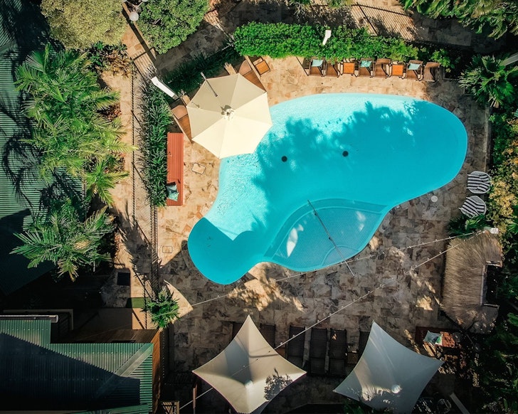 An aerial view of the pool and accommodation at Palms City Resort one of the best Darwin hotels