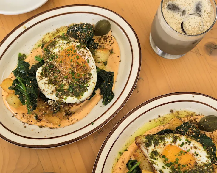 Two plates of breakfast hash and salted maple hojicha at Parable House. 