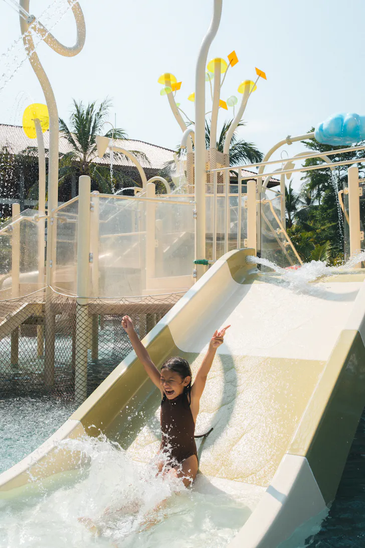 A child on the water slide at Paradisus By Meliá Bali