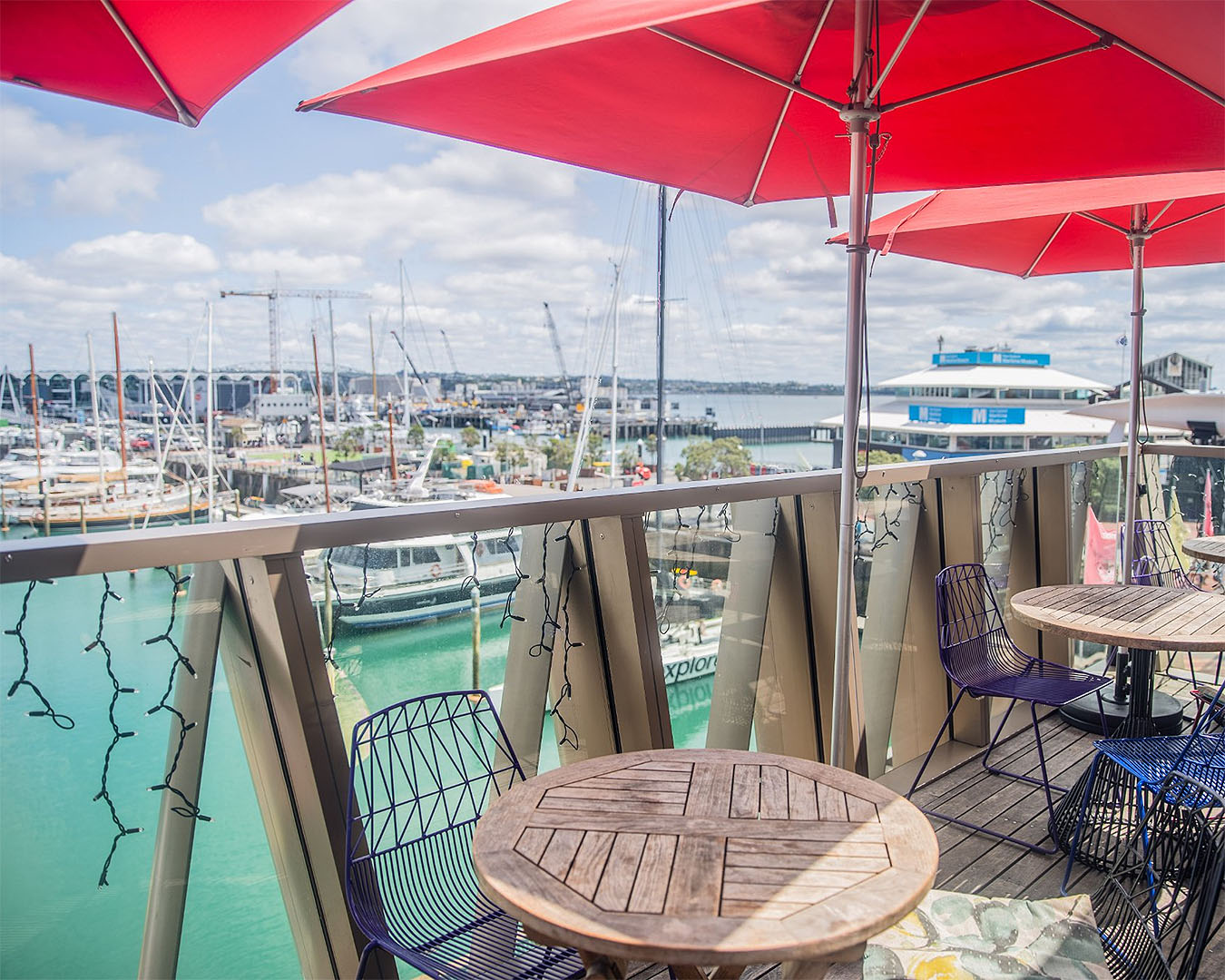 The deck at Parasol and Swing looks over Auckland viaduct looking inviting. No wonder this is one of the best rooftop bars in Auckland.