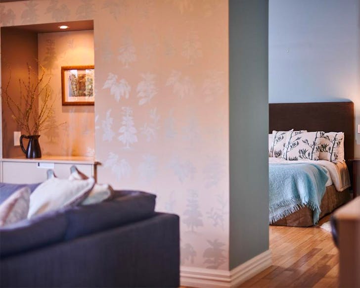 A lovely sitting room looks onto a bedroom at Parehua Resort, one of the best hotels in Martinborough.