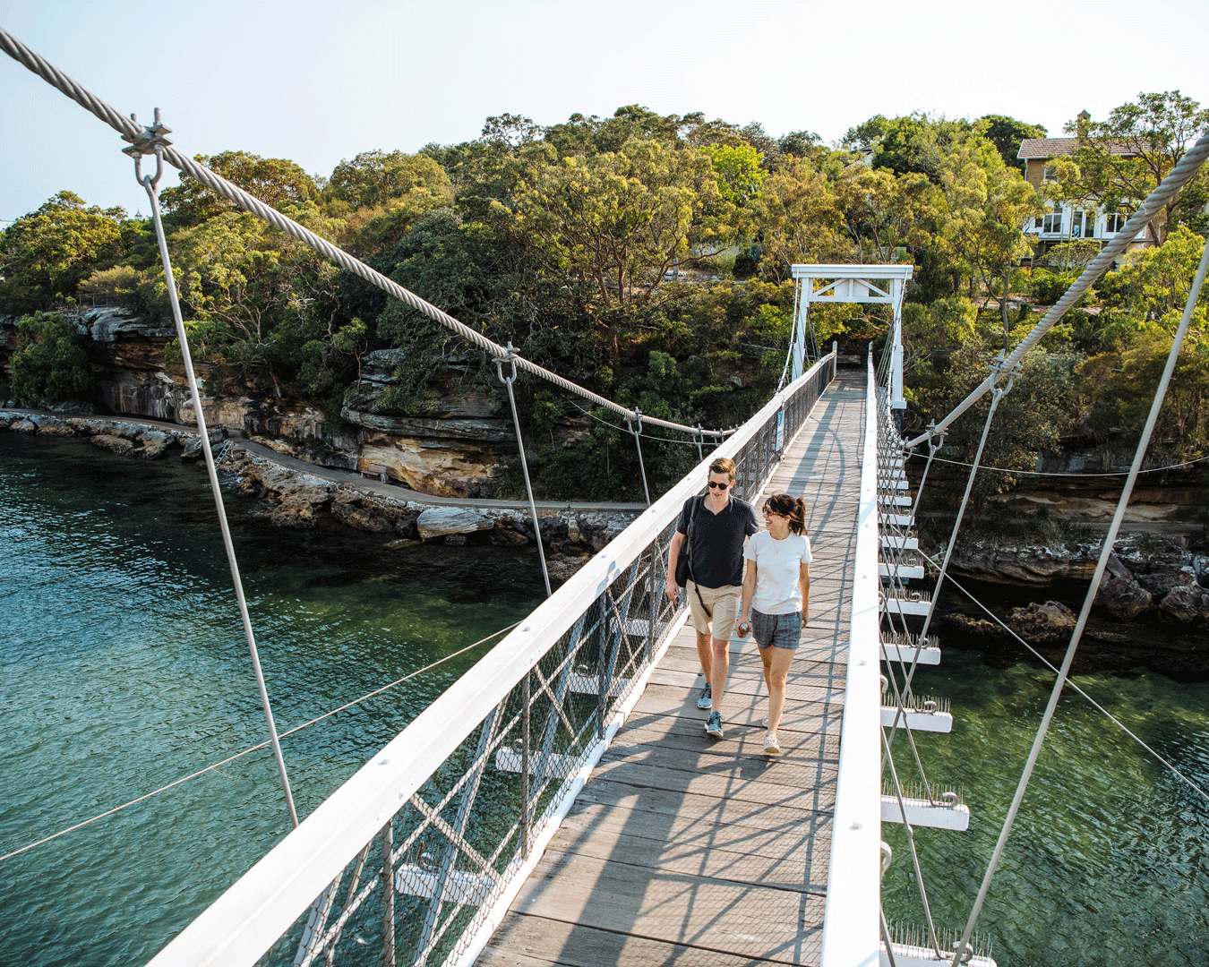 Couple walking over a bridge