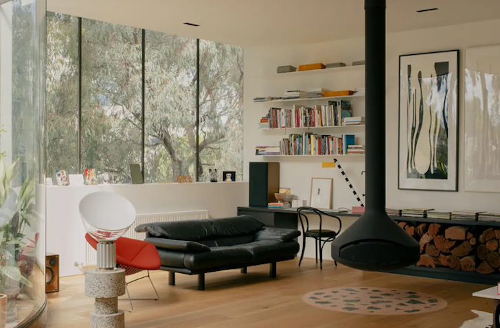 A view of the living space with indoor fireplace at Penthouse Palazzo Airbnb Victoria