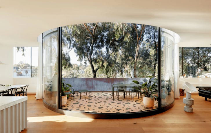 A large apartment with an open outdoor dining area.