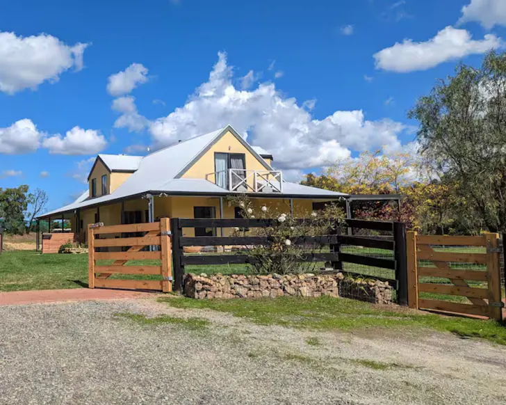 An exterior view of Pepper Tree Farm with its large garden, one of the best pet-friendly Airbnbs near Adelaide