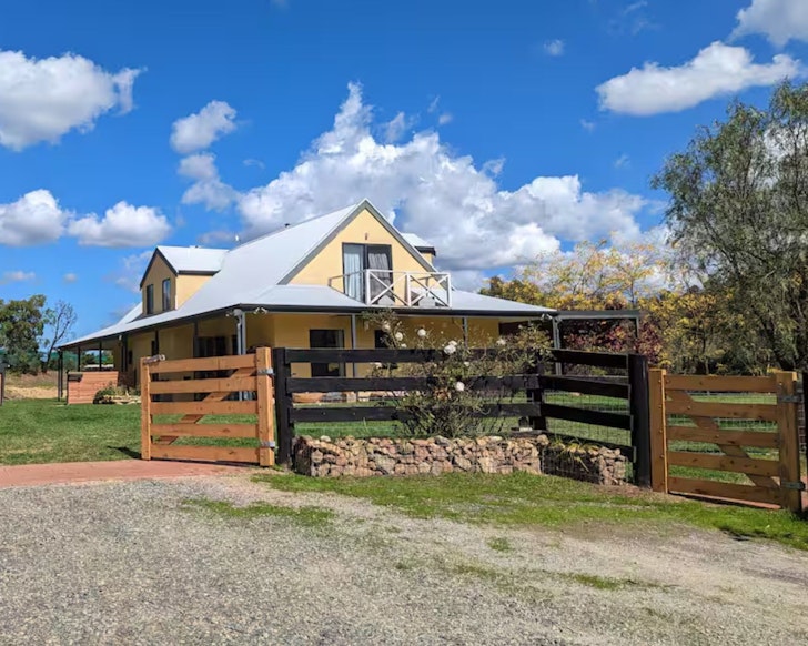 An exterior view of Pepper Tree Farm with its large garden, one of the best pet-friendly Airbnbs near Adelaide