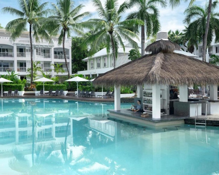 A view of the pool and pool bar at Peppers Beach Club one of the best luxury resorts in Queensland