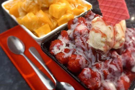 A mango and a strawberry snowflake bowl.