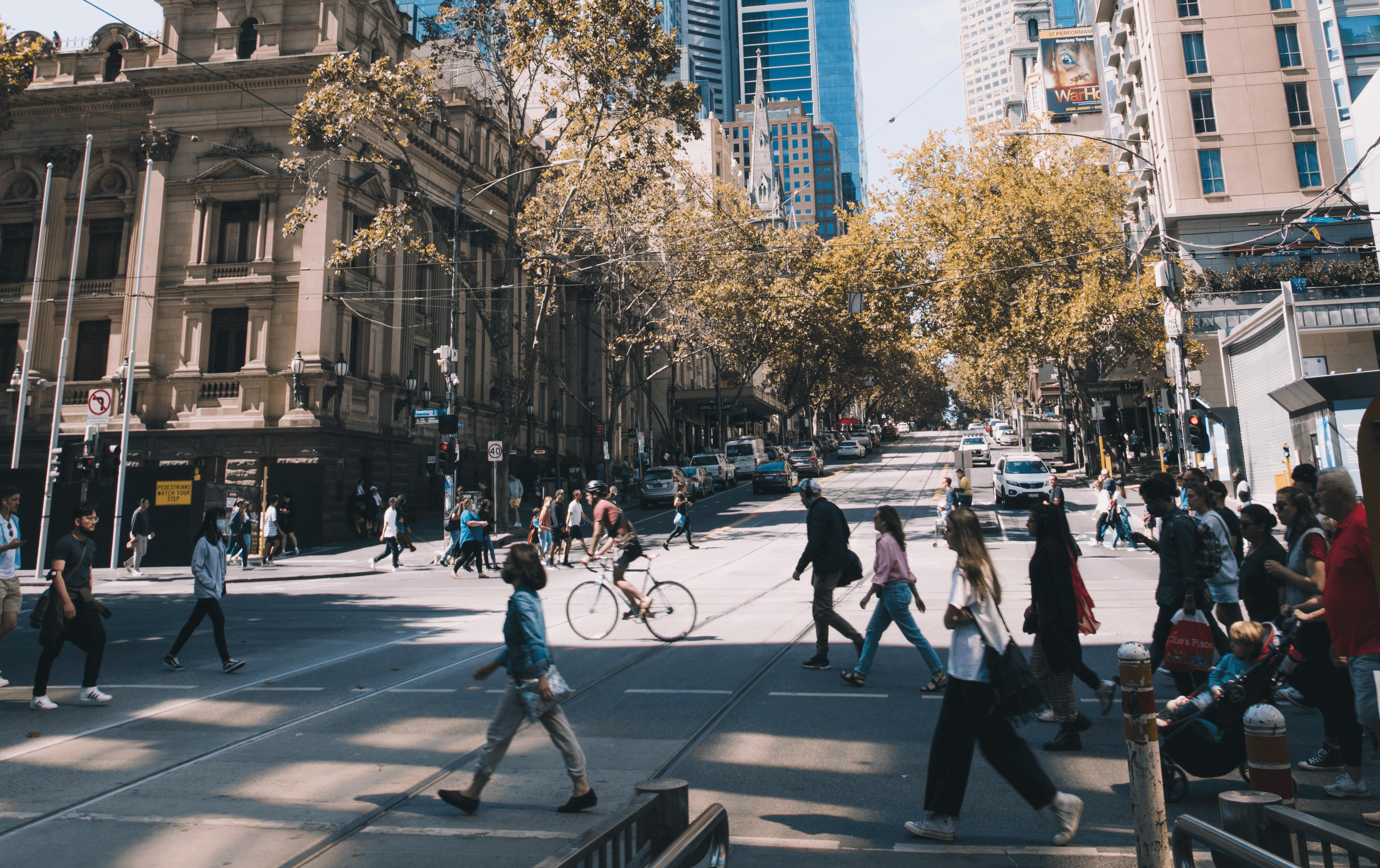The CBD with people walking across a street.