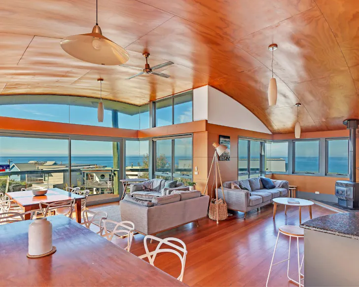 The living space with water views at Phillip Island Waterfront House one of the best Phillip Island Airbnbs